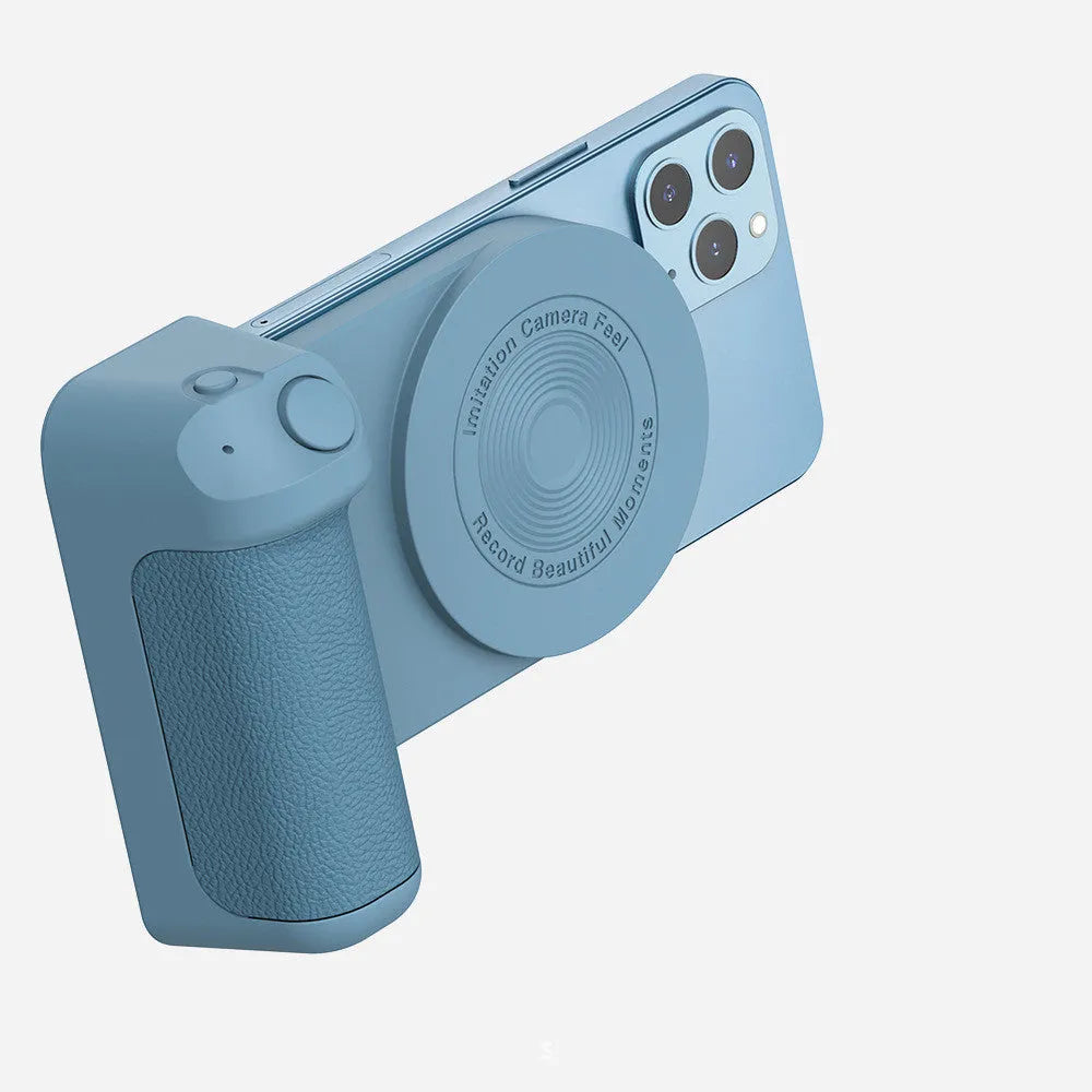 Black magnetic 3-in-1 phone camera grip and stand with ergonomic handle on a table