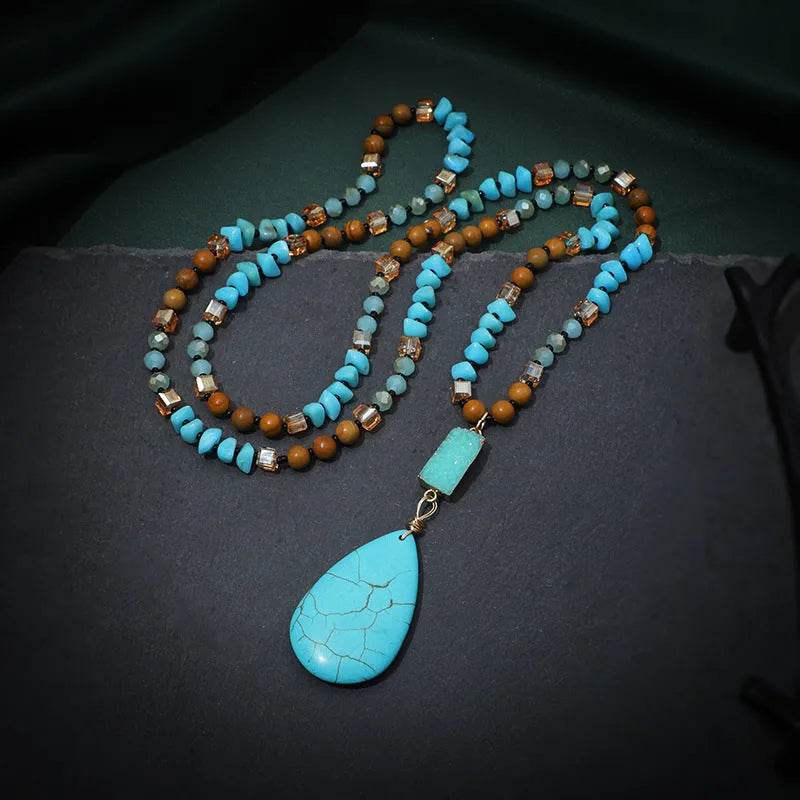 Turquoise water drop shaped pendant necklace with mixed gem inlaid detailing on ball bead chain