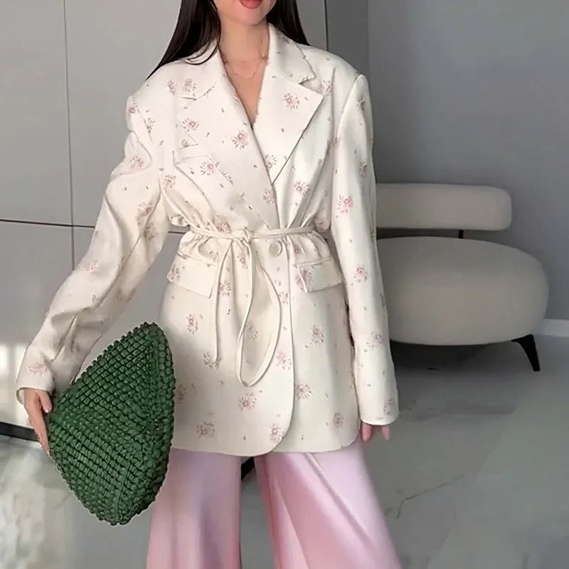 Women's collar lace-up waist-tight suit jacket in polyester, showing front tie detail on a model.