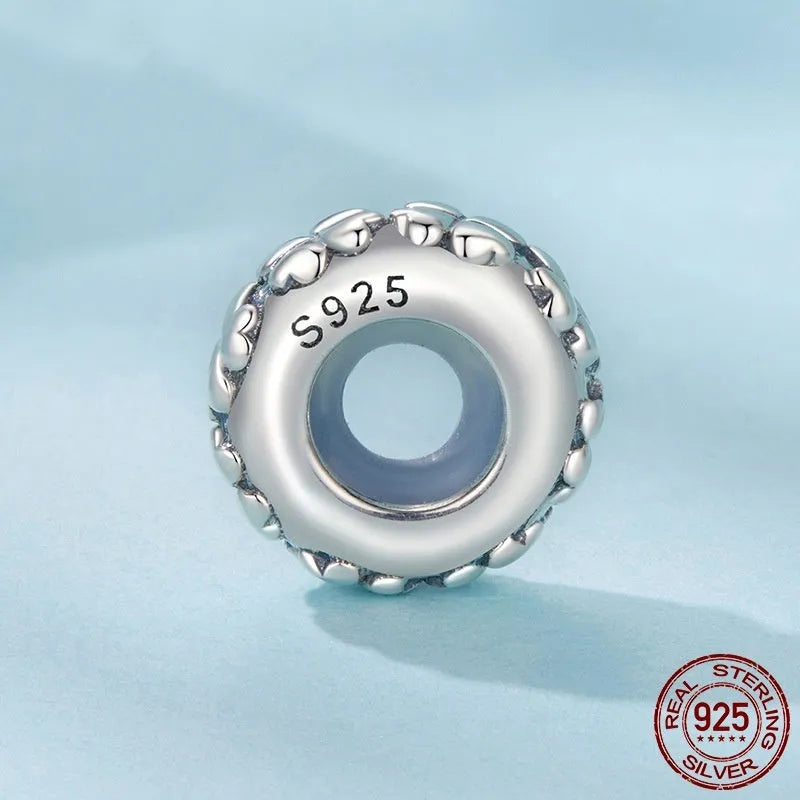 Four-leaf clover shaped S925 sterling silver spacer bead with pearlescent finish, 1.0cm height