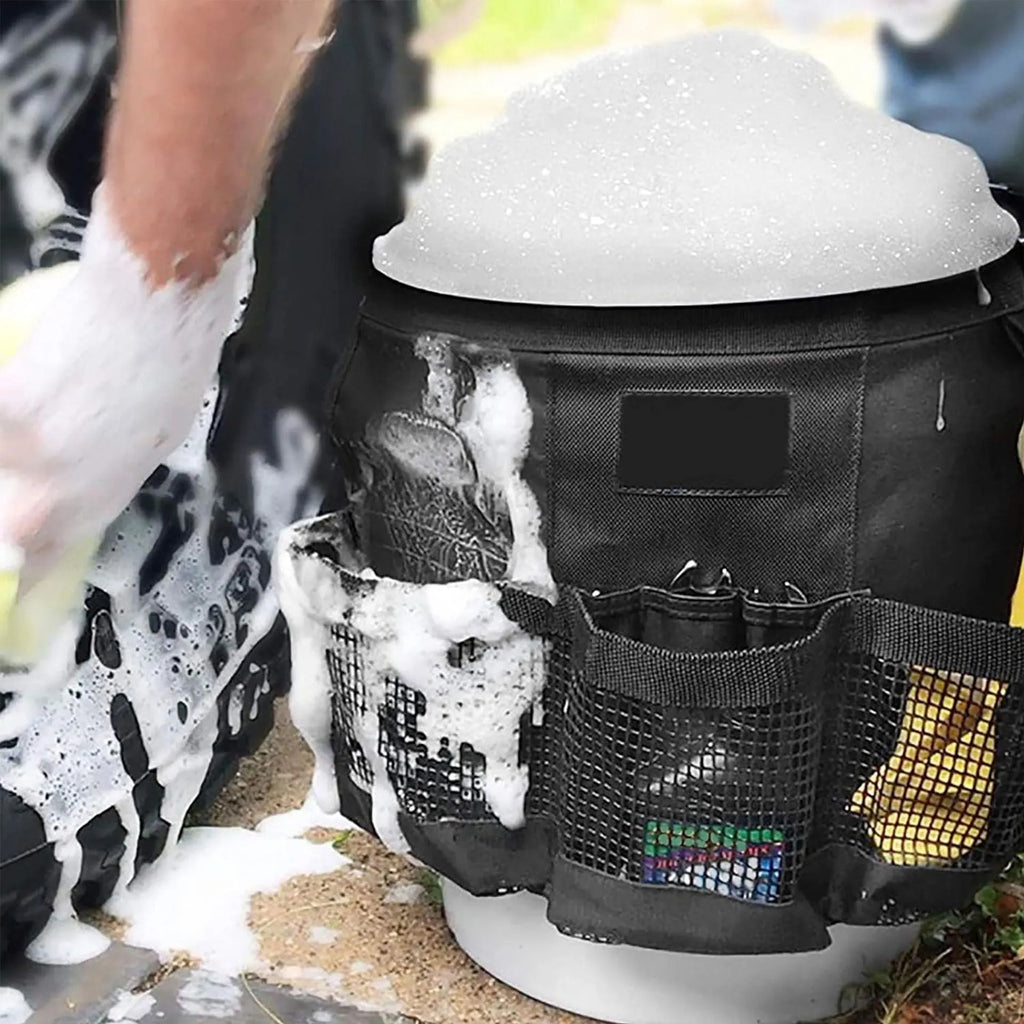 Black cylindrical polyester hanging storage bag designed to fit on a 5-gallon bucket for tool organisation.