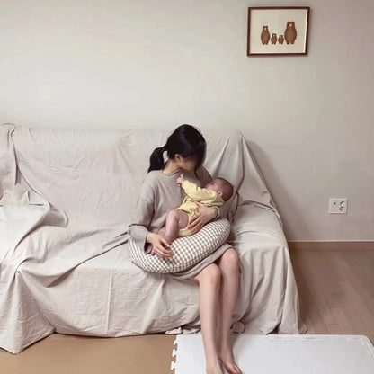 Moon-shaped baby nursing pillow in plaid cotton for newborns, available in yellow, green, and brown