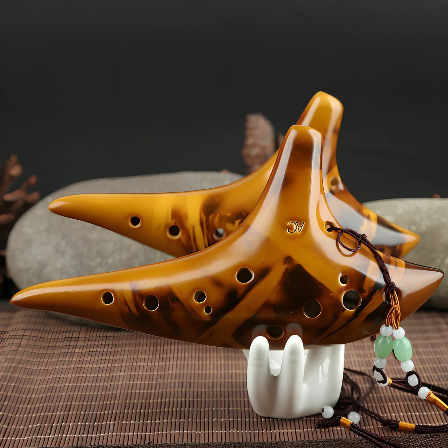Yellow 12-hole ceramic ocarina in Alto C with 13-note range and integrated lanyard