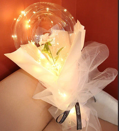 A captivating bouquet of LED-lit balloons and rose blooms, creating a mesmerizing ambiance for any celebration.