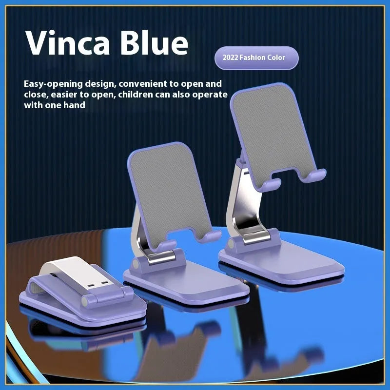 Q7 weighted portable folding desktop stand in four colour options holding mobile phone