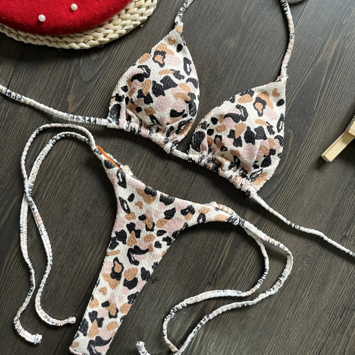 Women's printed bikini swimsuit with briefs style on a mannequin, showing the cotton lining and high elasticity fabric.