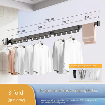 Aluminum retractable clothes drying rack mounted on wall with suction cups