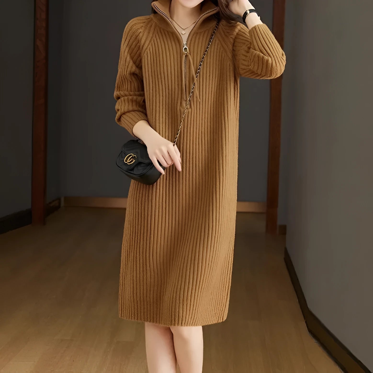 Beige half zip straight skirt with long sleeves and a stand collar, shown on a model.