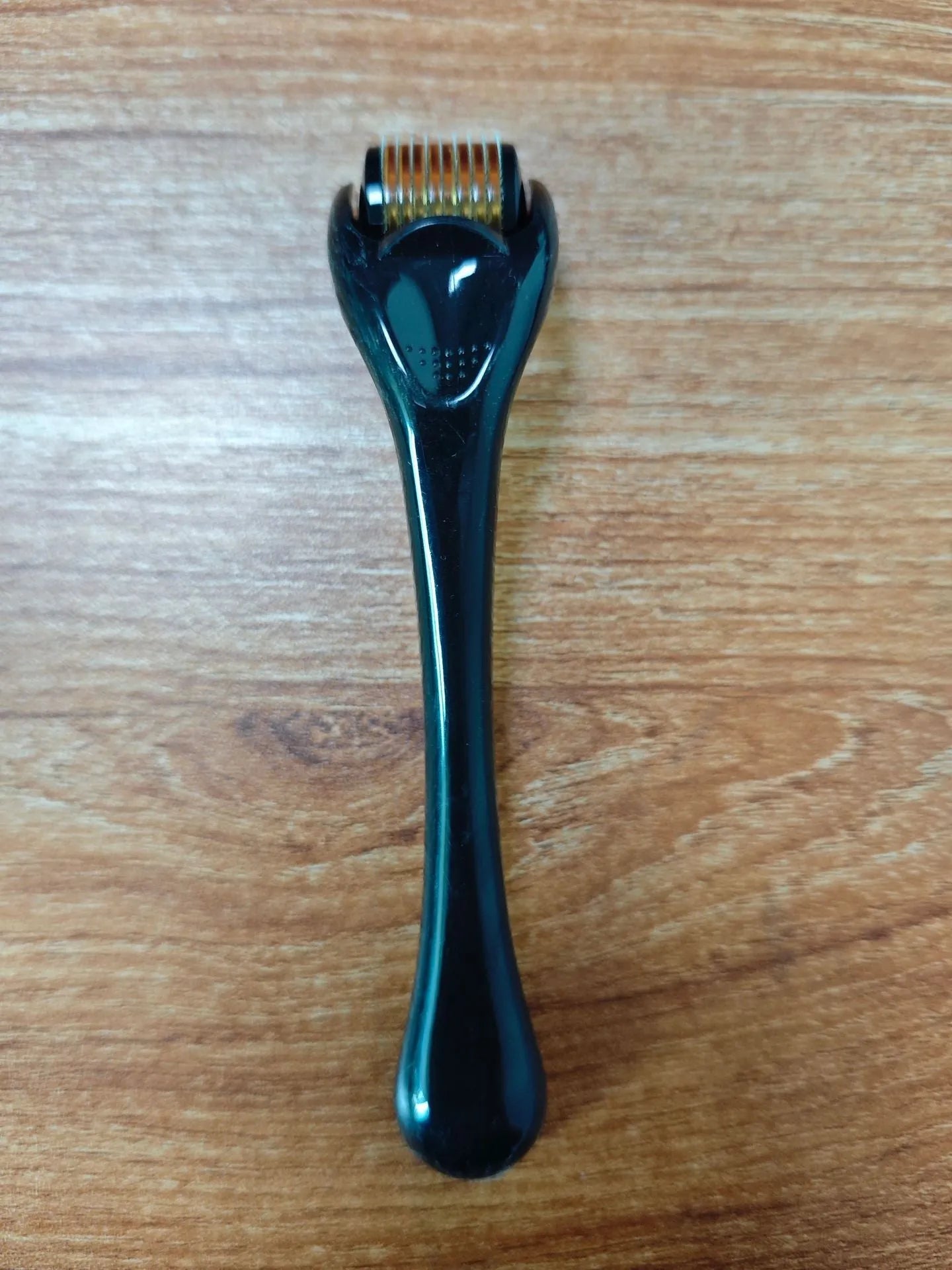 540 needle microneedle derma roller with colour wheel on black handle, showing 0.25mm specification.