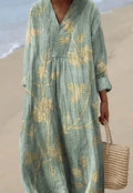 Casual long floral shirt dress with 3D print, wide waist, and regular sleeves on a hanger.