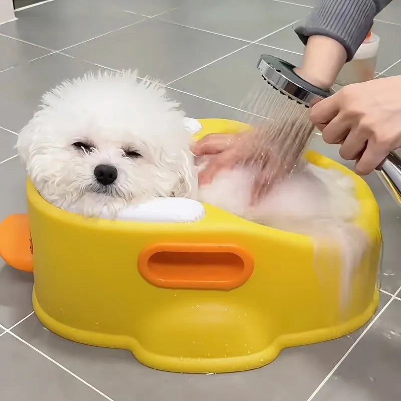 Blue foldable duck-shaped PVC bathtub for washing a dog or cat.