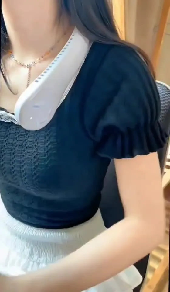 A pink portable bladeless neck fan with a soft neckband, shown being worn.