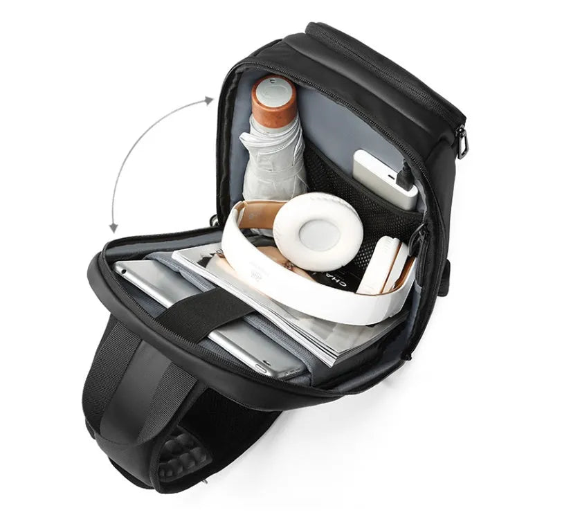 Black PVC outdoor shoulder bag with air cushion strap and internal organisation pockets