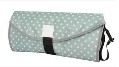 Waterproof portable baby changing pad in various colors, perfect for on-the-go nappy changes