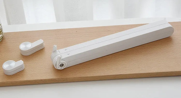 White portable laptop cooling stand with adjustable height and folding mechanism