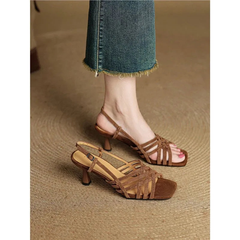 Retro-style women's high heel sandals with thin cross straps and an ankle buckle in light brown.