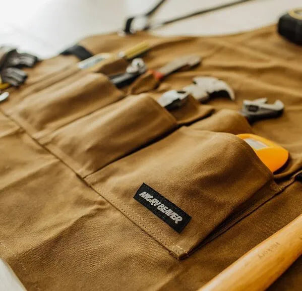 Yellow leather webbing work apron with multiple tool pockets and adjustable straps