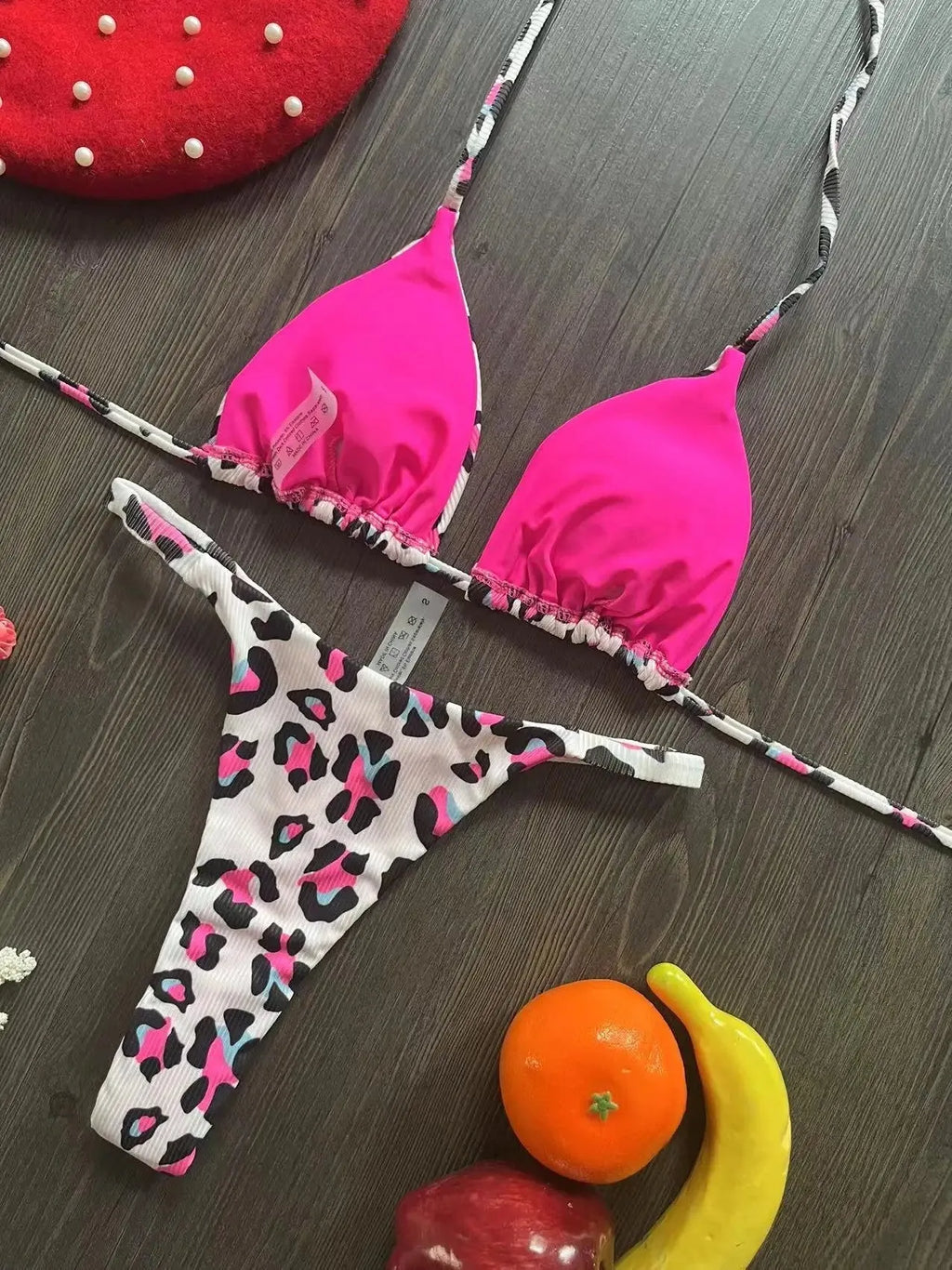 Women's printed bikini swimsuit with briefs style on a mannequin, showing the cotton lining and high elasticity fabric.