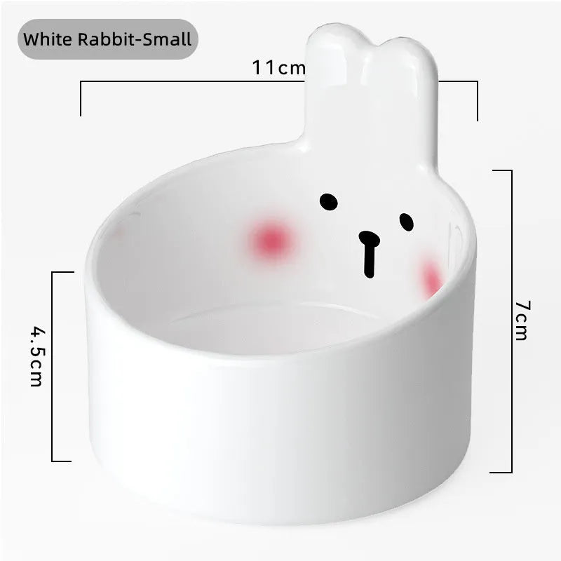 Blush Critter ceramic pet food bowl in white rabbit design, showing raised neck protection ring.
