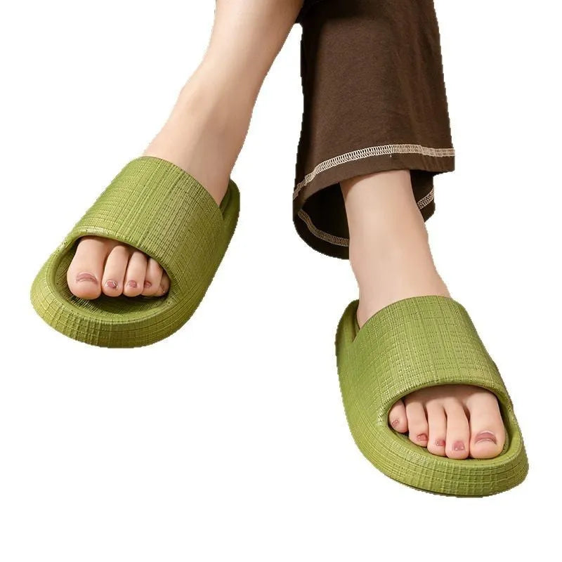 A pair of soft-bottom EVA bath slippers with a toe ring and non-slip sole, shown in one of five available colours.