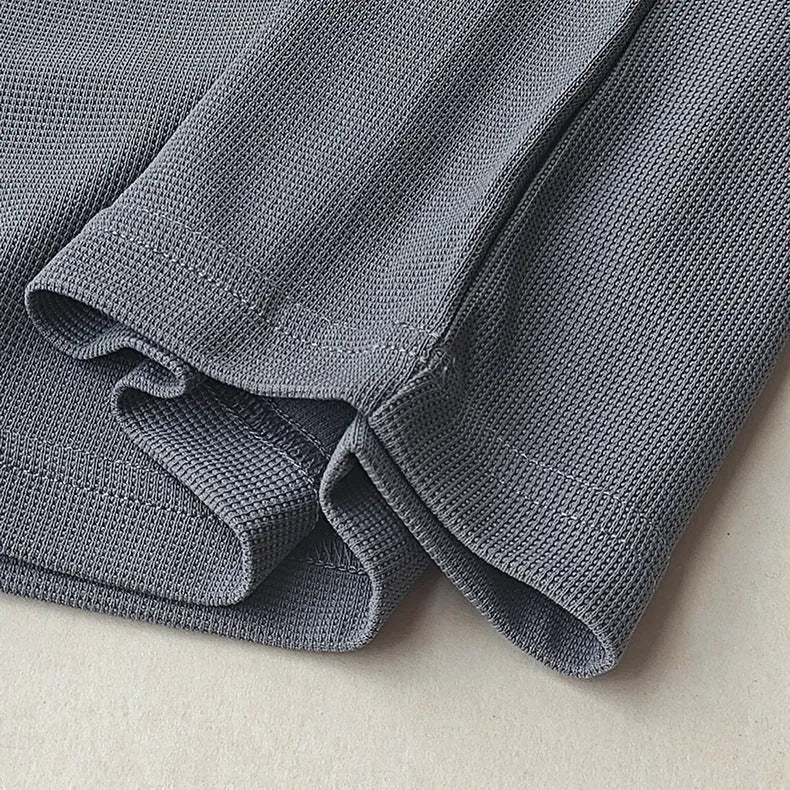 Men's heavy waffle-textured short-sleeved T-shirt in polyester with wool lining, shown in a solid colour.