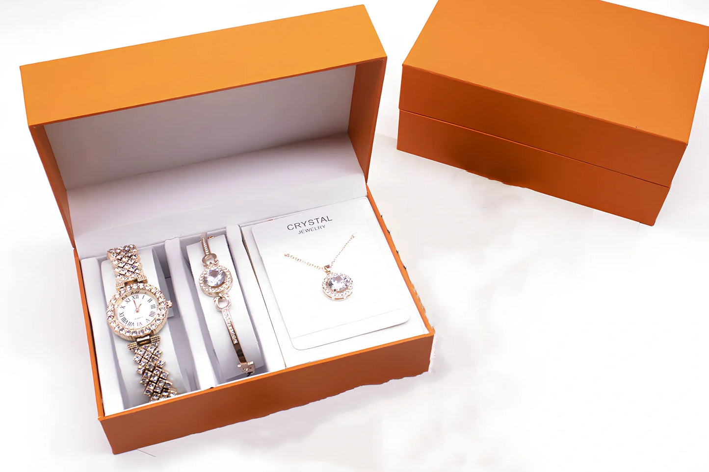 3-piece rhinestone quartz watch set with 22.5cm gold alloy strap, bracelet, and necklace on display