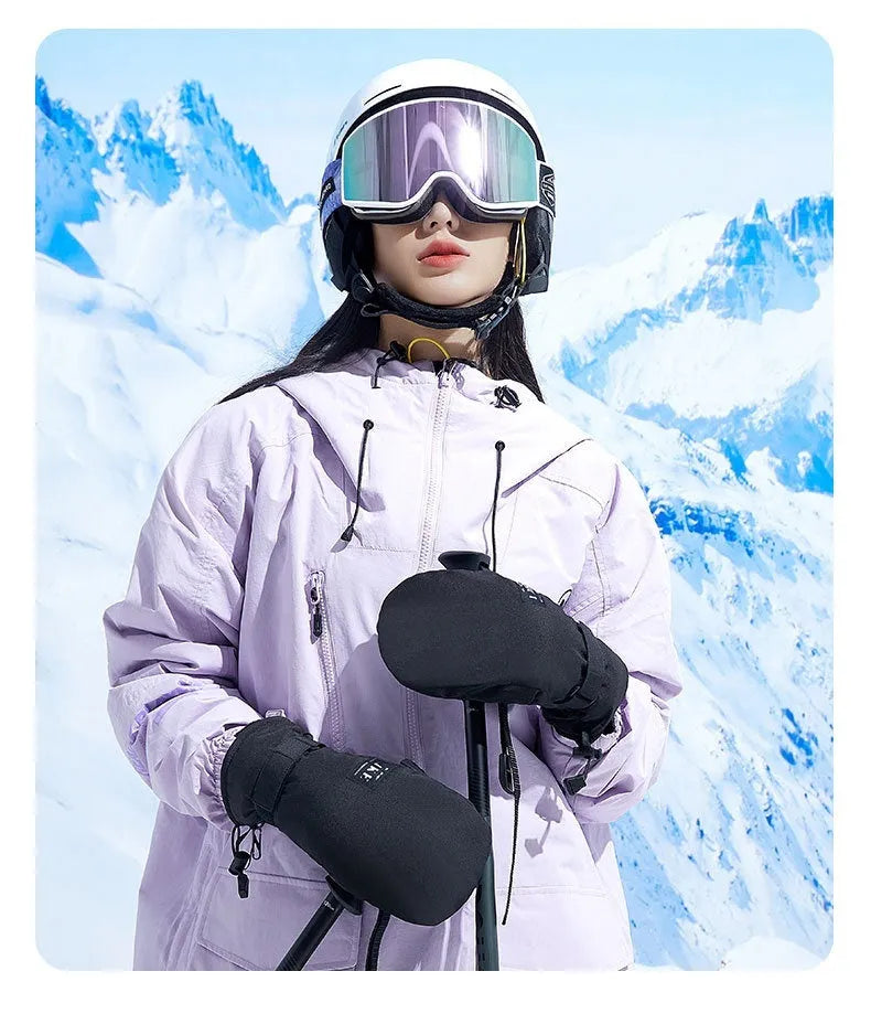 A pair of thick black winter cycling mittens with touch screen fingertips on a bicycle handlebar.
