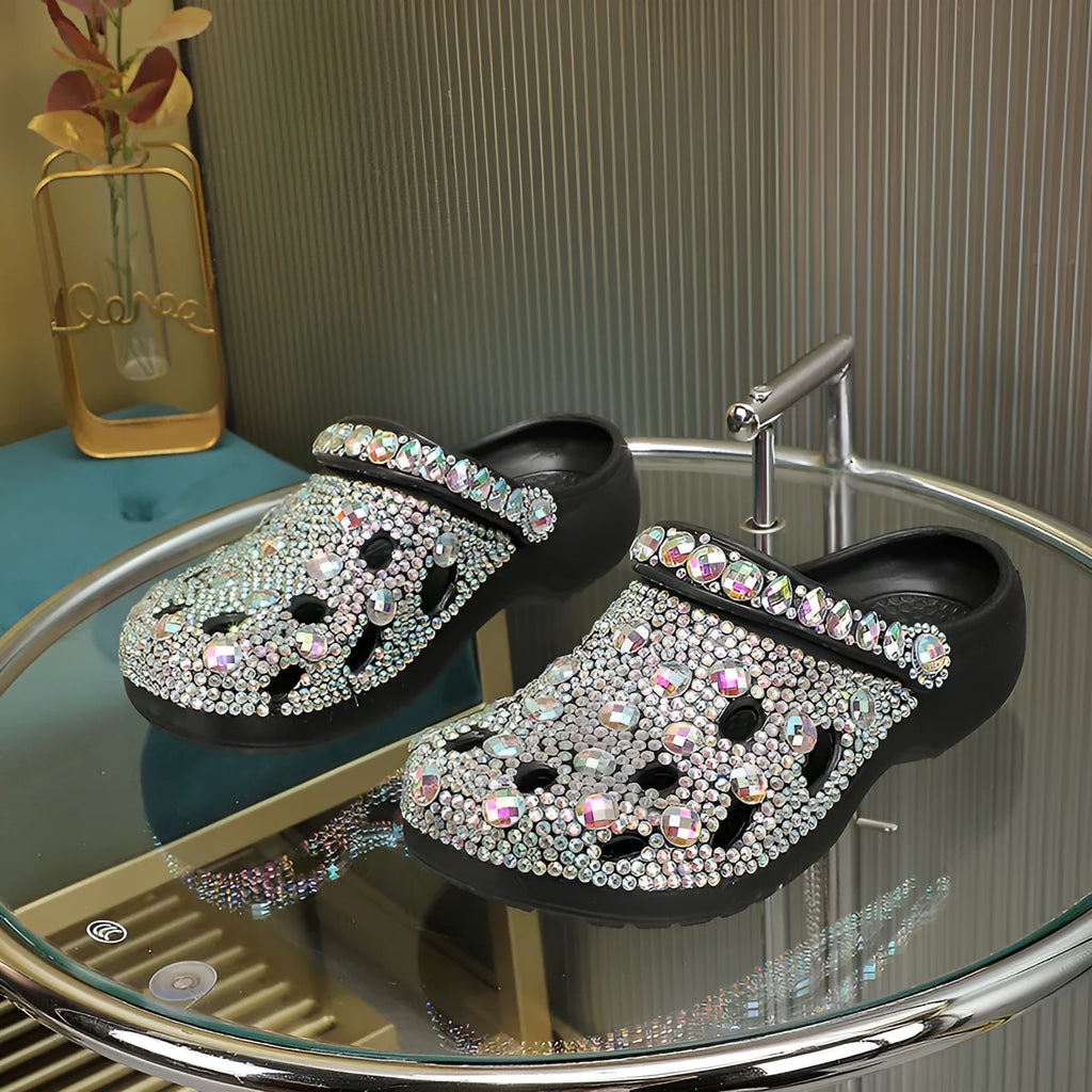 Black women's platform sandals with rhinestone detail on EVA upper and thick sole.