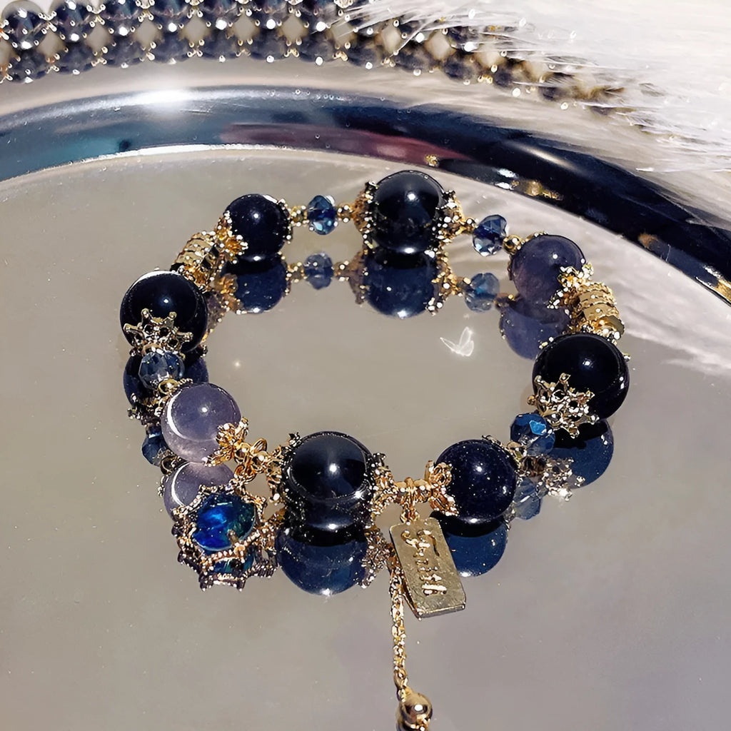 Women's galaxy colour bracelet with snowflake pendant and bow design elements
