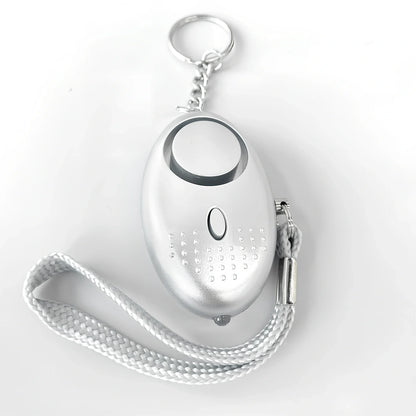 Black self-defence keychain set with alarm, bottle opener, and multiple protection tools