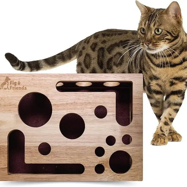 Solid wood square maze cat toy in natural wood colour on a floor