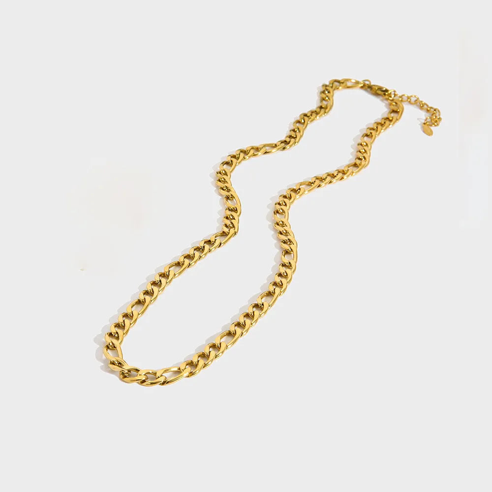 Gold electroplated stainless steel necklace with geometry pendant on white background