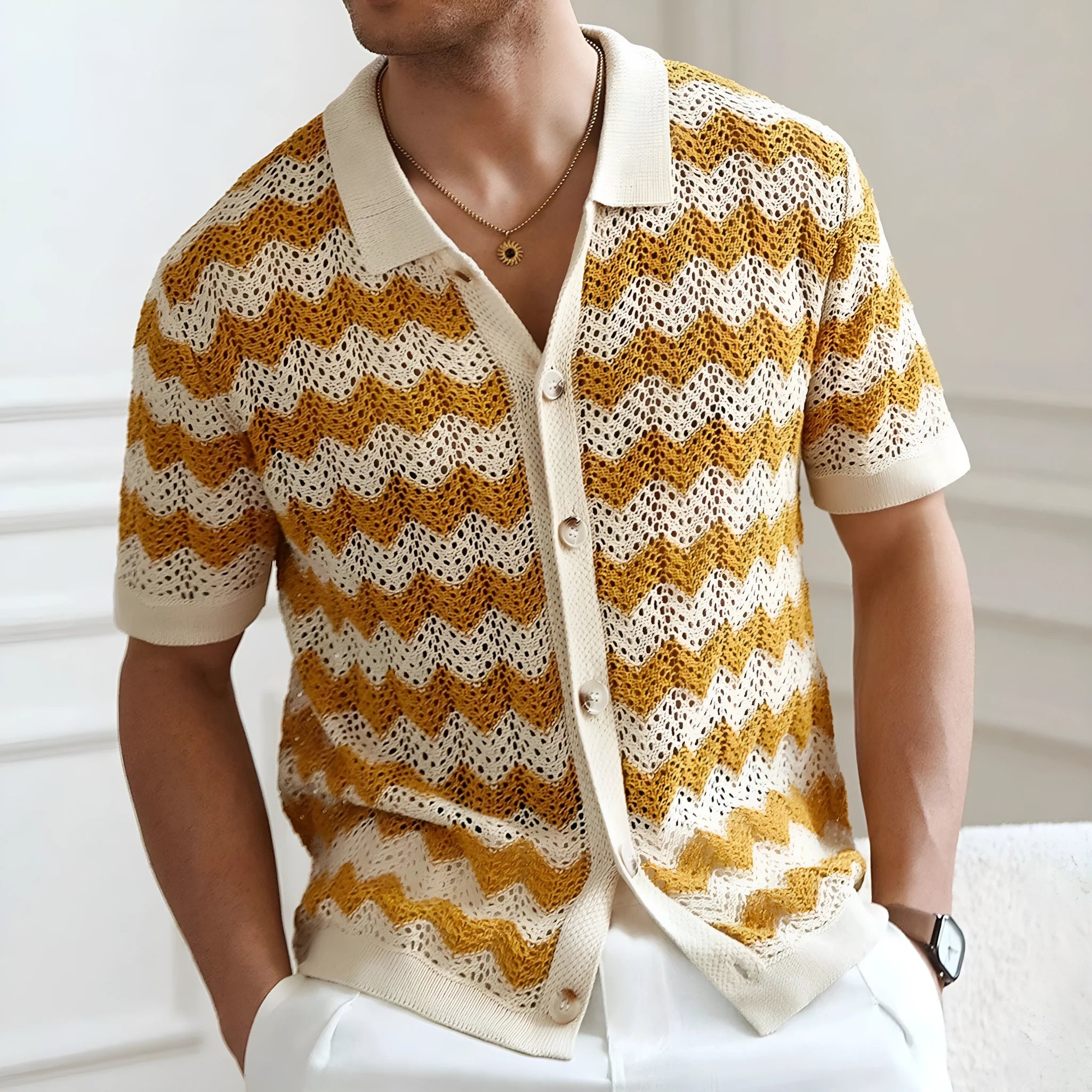 A yellow short-sleeve sweater with a textured corrugated jacquard pattern and a flocked surface detail.