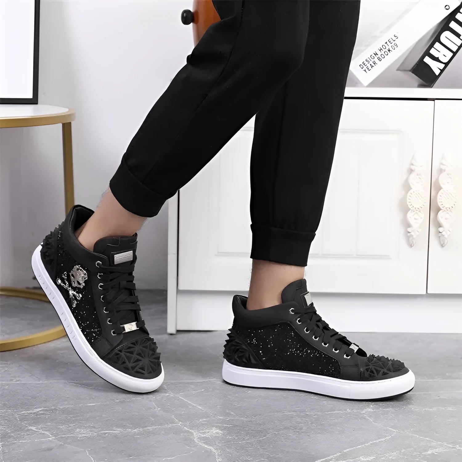 Men's black genuine leather high top skeleton shoes with red laces on a rubber sole.
