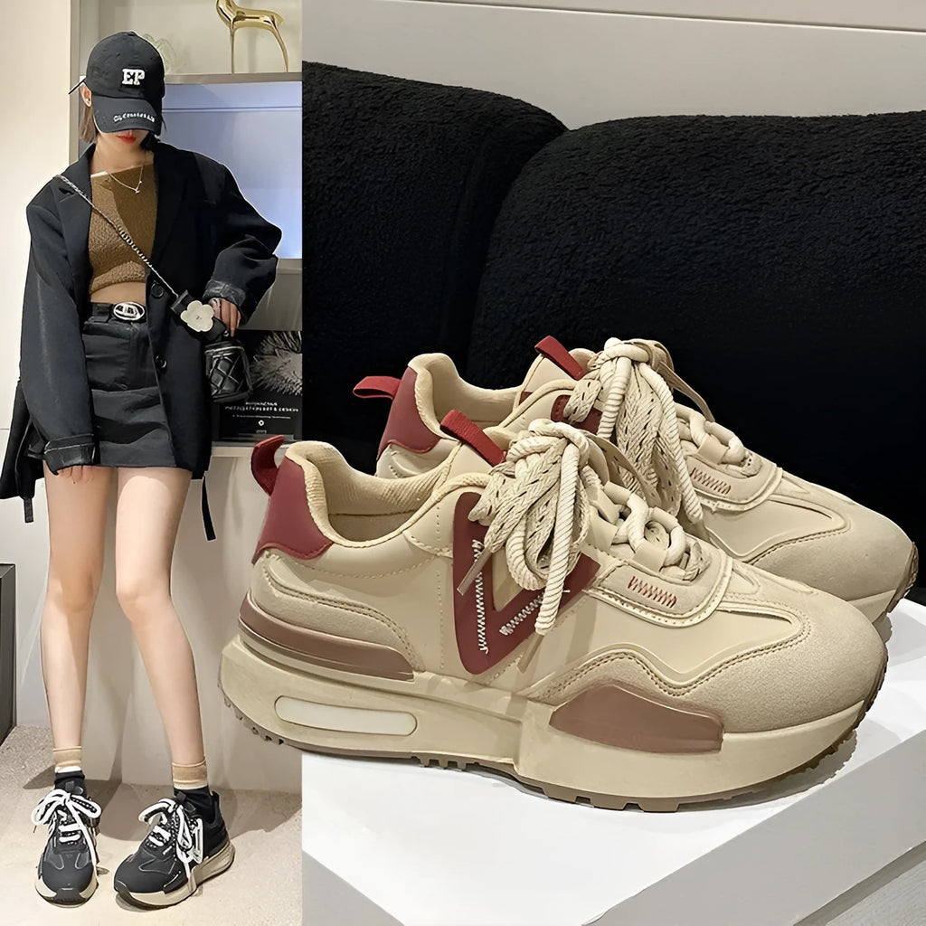 Women's black retro platform sports shoes with round toe and lace-up front on white background