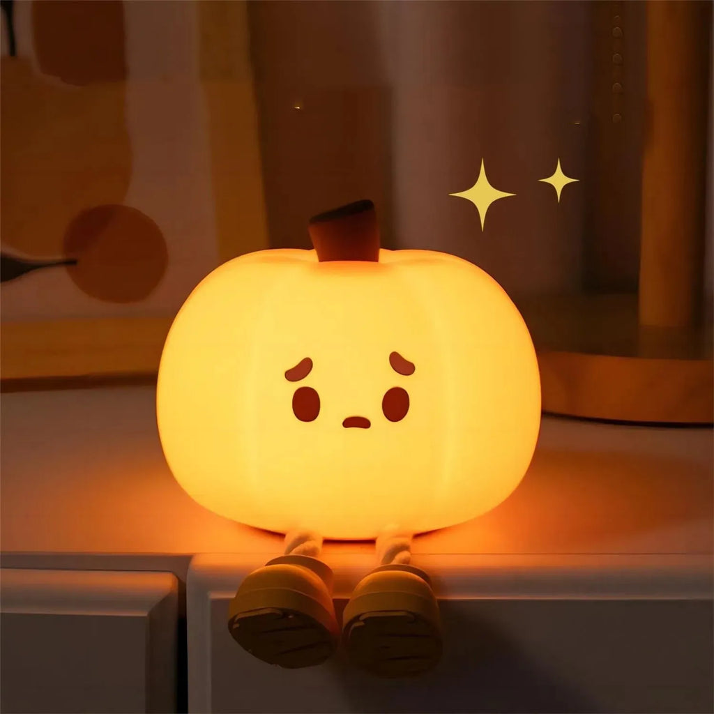 Soft silicone pumpkin night light with touch controls and warm LED glow