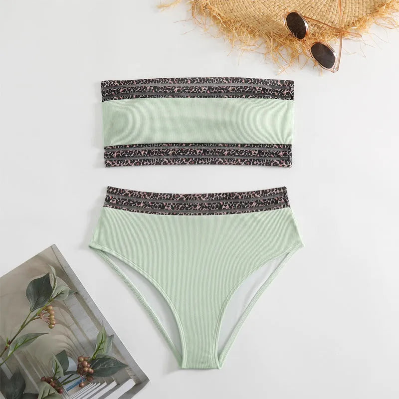 Black strapless bikini set with leopard print detail, showing separate bra and shorts.