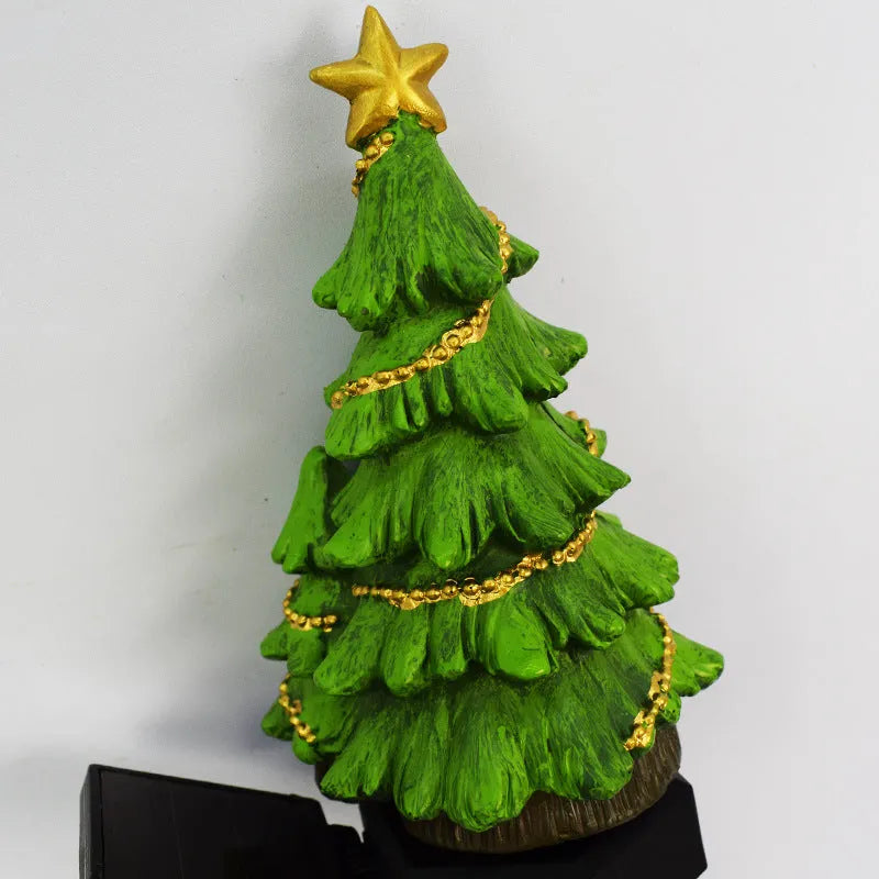 Solar Christmas tree ground plug light with warm white LED on a lawn, IP65 waterproof resin construction