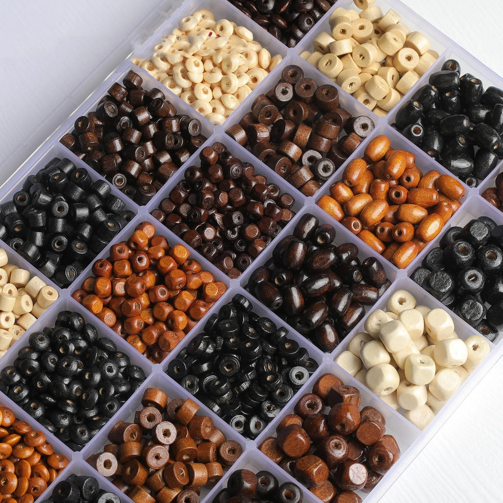 Scattered vintage solid wood beads in mixed colours for DIY jewellery making.