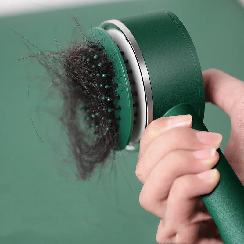 Long handle air cushion comb in green with plastic body for hair styling