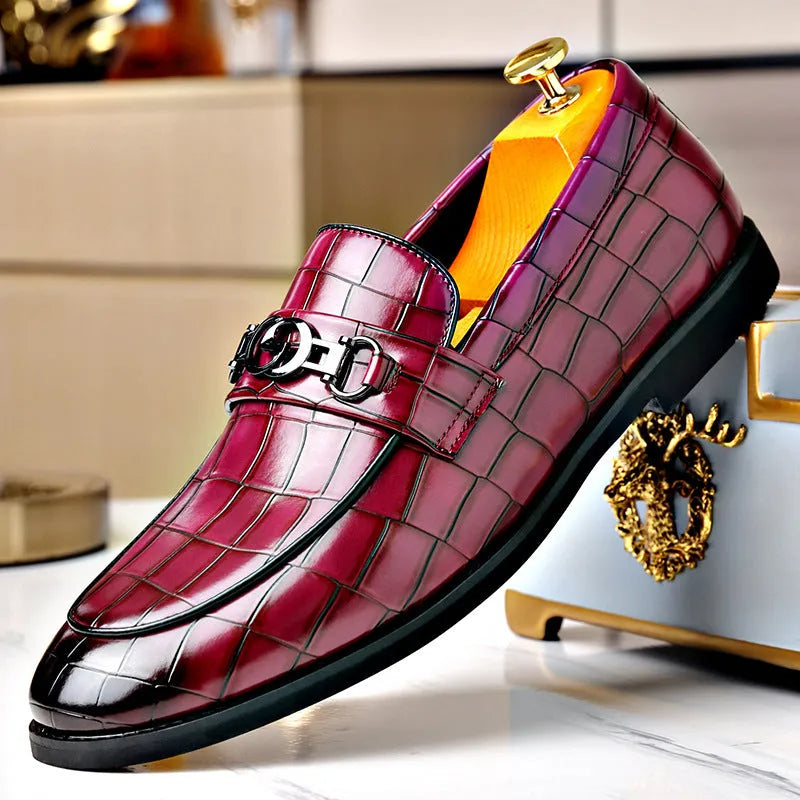 Men's casual leather shoes with embossed horsebit buckle in black, side view showing flat wedge heel and rubber sole