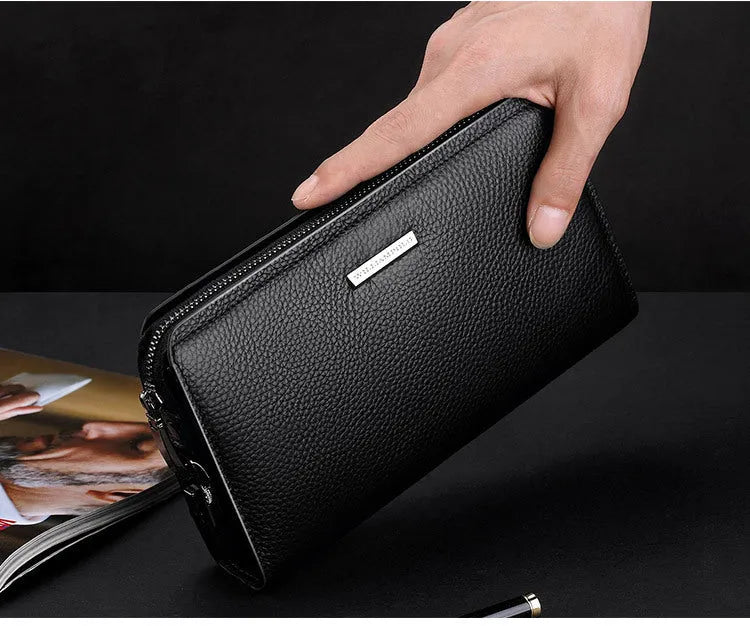 Men's black genuine leather wallet clutch open showing multiple card slots and compartments