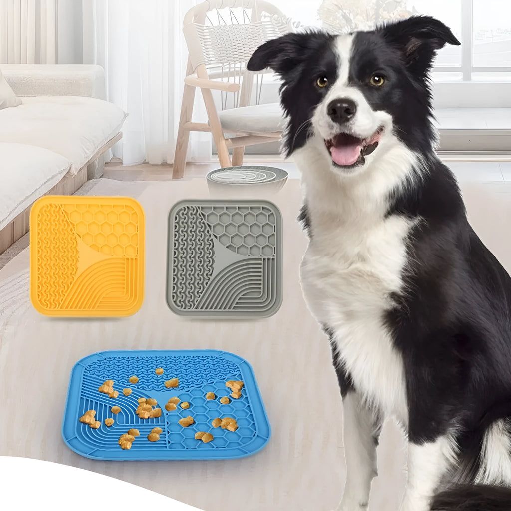 Gray silicone anti-choke slow feeding dog licking pad with textured surface on a flat surface