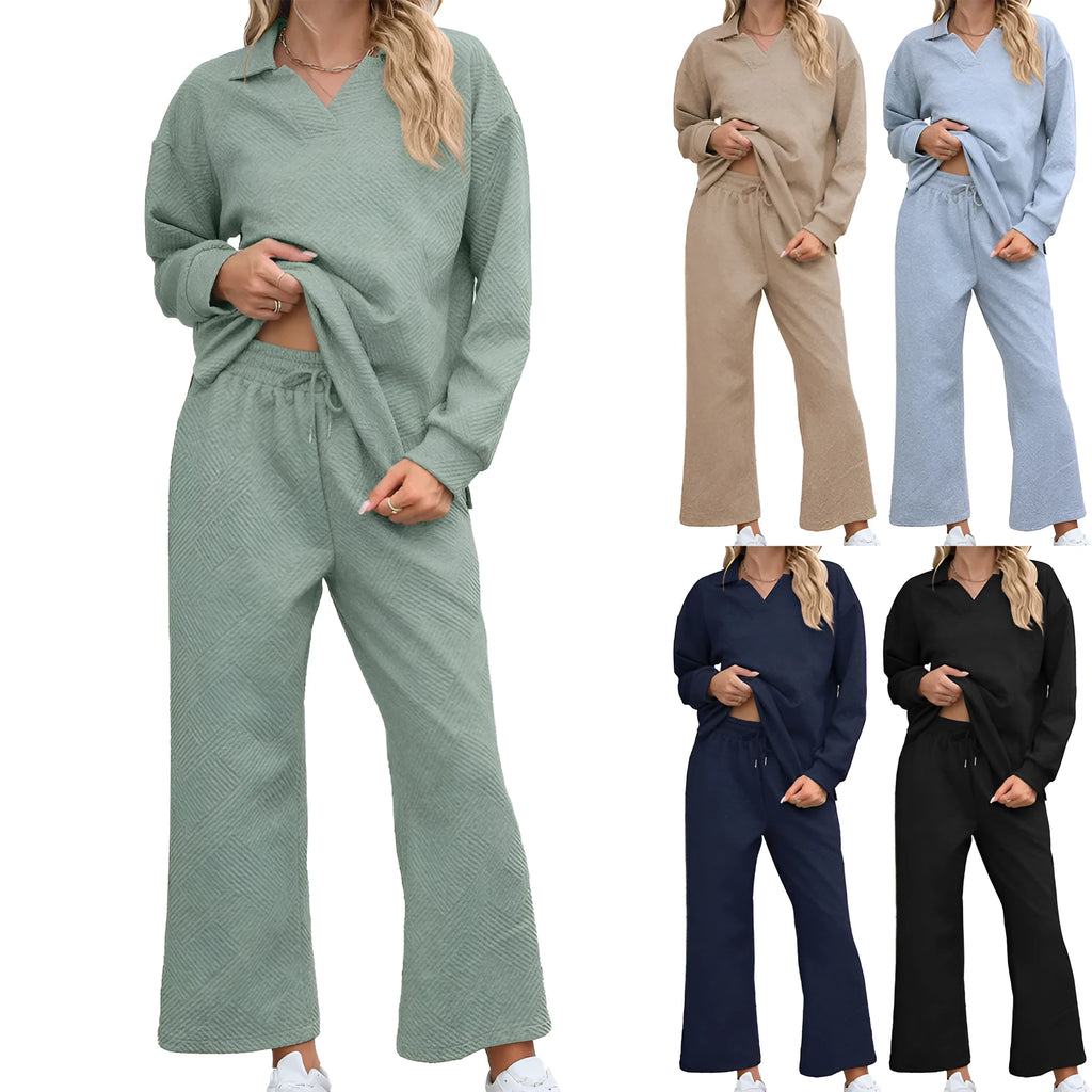 Women's solid colour knitted lapel sweater and elastic waist cropped trousers suit set laid flat.