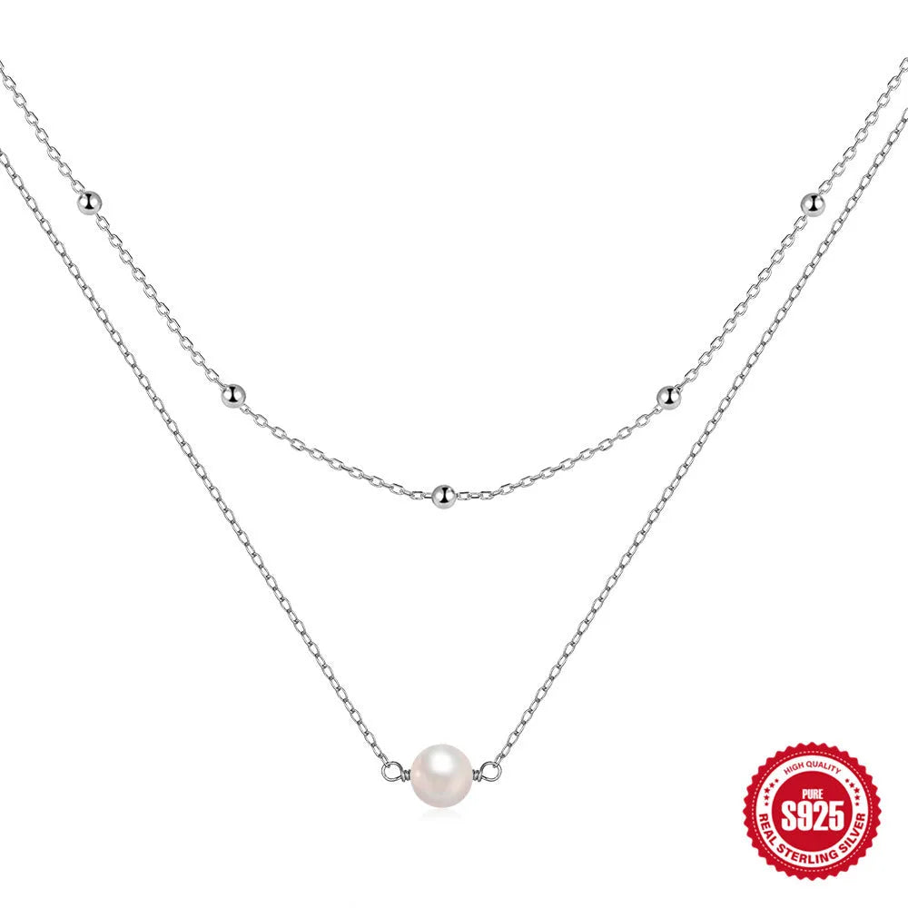 S925 sterling silver necklace with double-layer twin pearl pendant on a ball bead chain, shown in gold colour.
