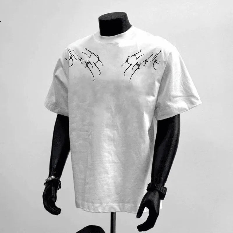 Man wearing a black loose fit pure cotton short sleeve tee shirt with a print design.