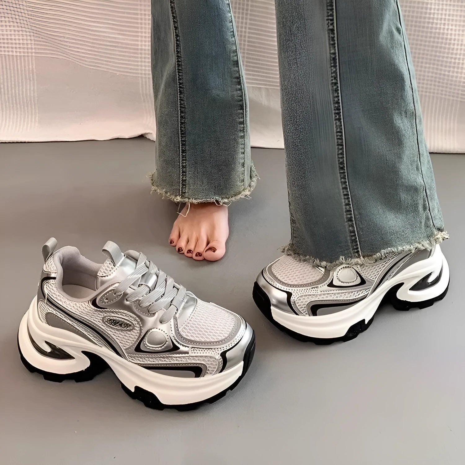 Women's Red and Silver clunky platform sneakers with mesh lining and rubber sole on a white background.