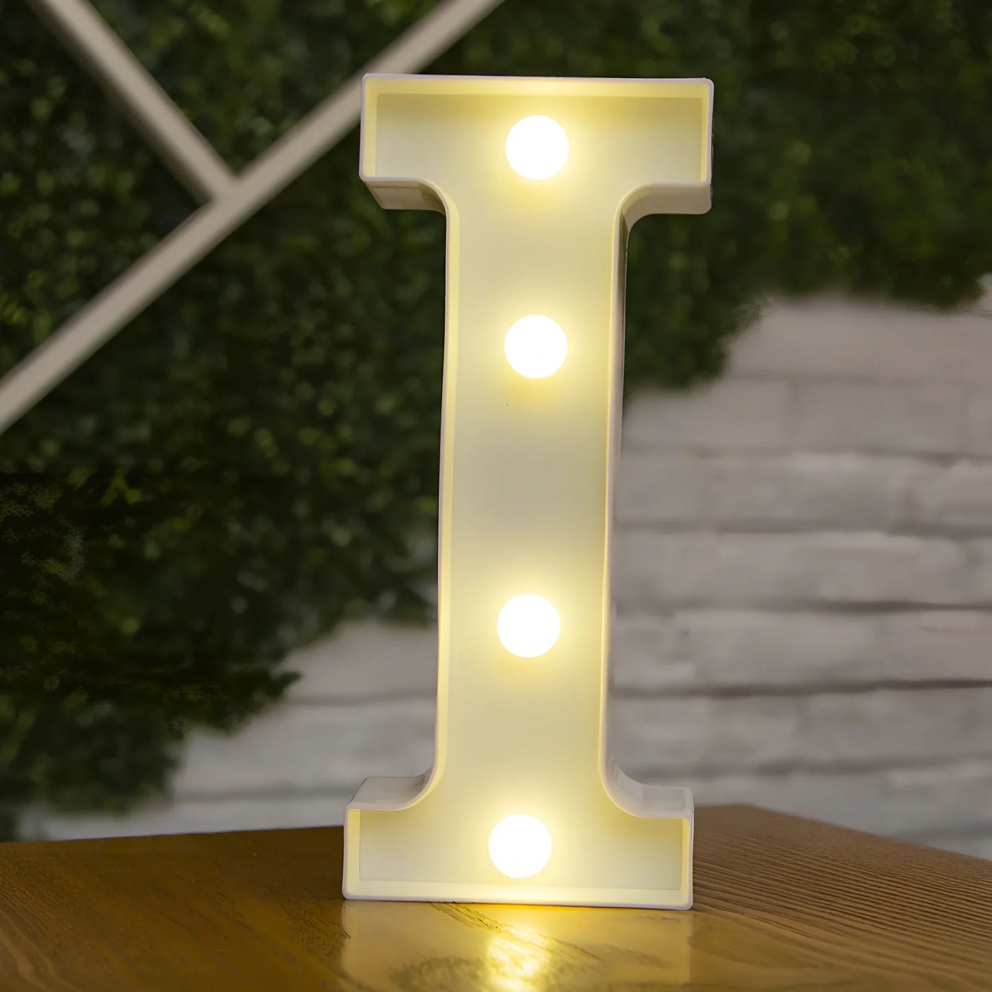 White plastic LED alphabet marquee sign with warm white illumination, 22cm height with battery operation
