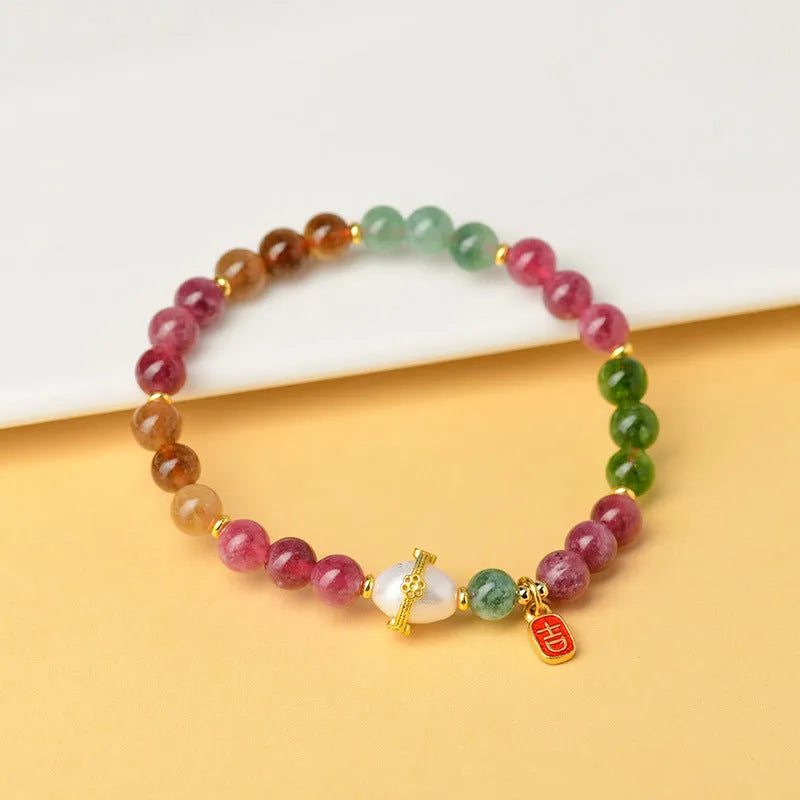 Geometric chalcedony bracelet with 6.5mm beads in optimised tourmaline colour Z054.