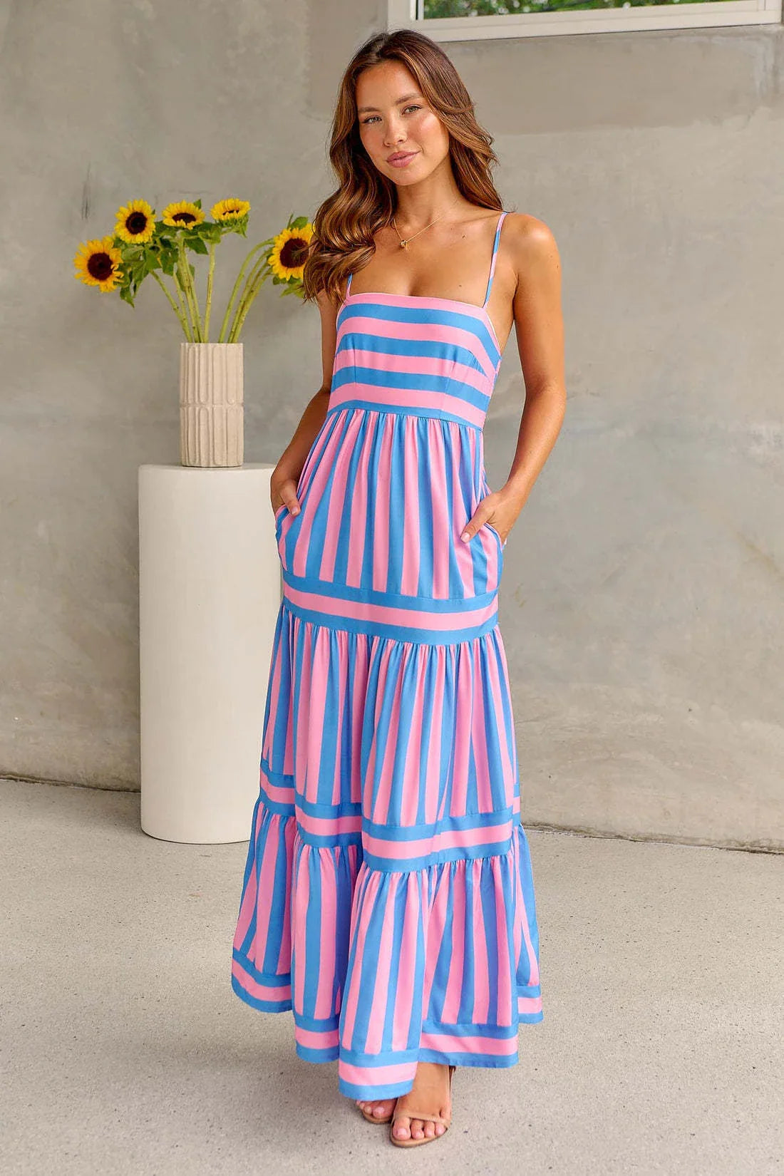 Stylish backless striped dress with square neckline, perfect for beach vacations